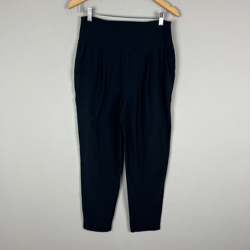 Athleta Elation Pants Women Medium Black Tapered Pleated Stretch Knit Athleisure